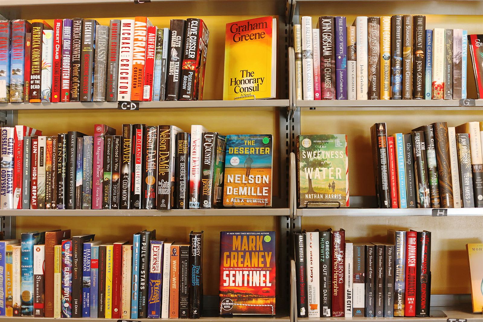 Shelves of fiction paperbacks and hardcovers at the Book Nook